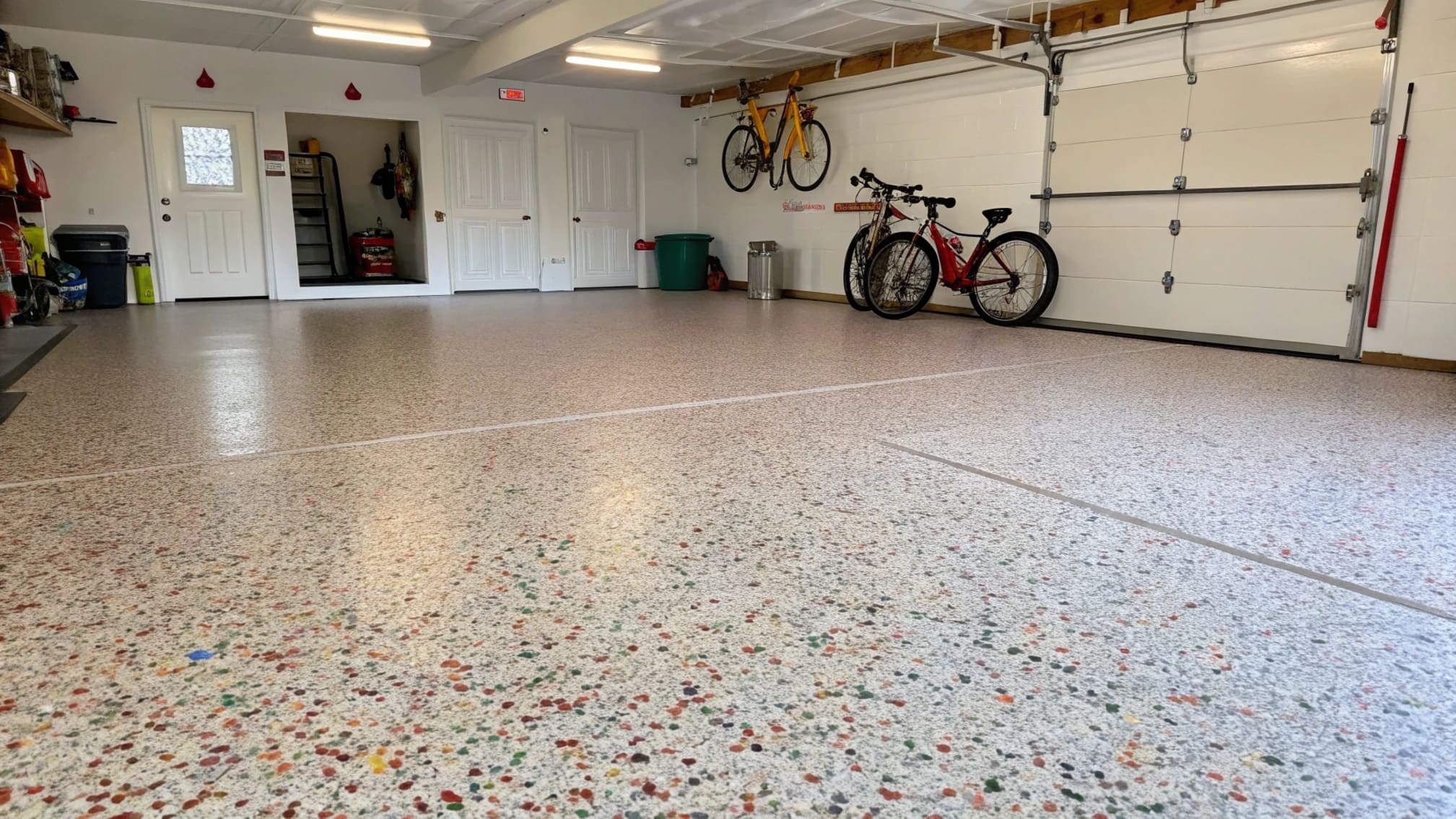 Garage floor with professionally applied color flake polyaspartic system